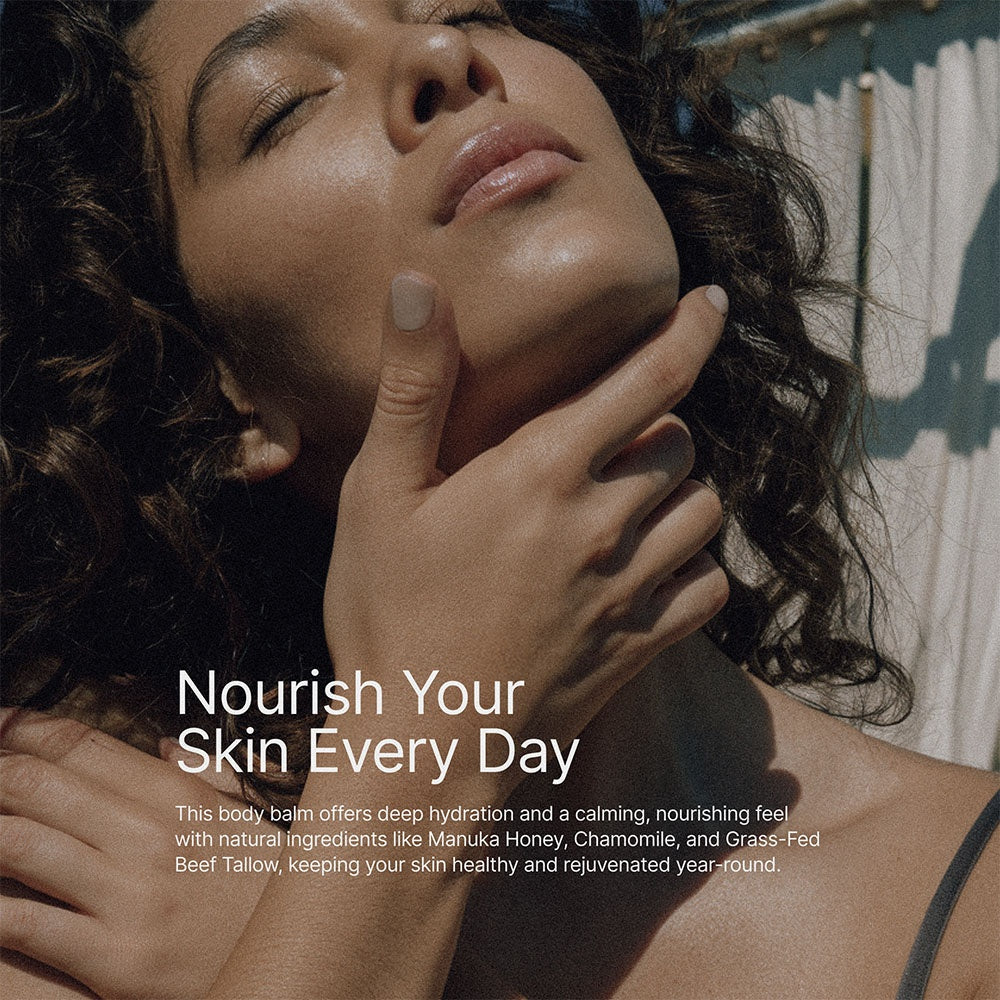 happy woman laying with eyes closed putting tallow on her face