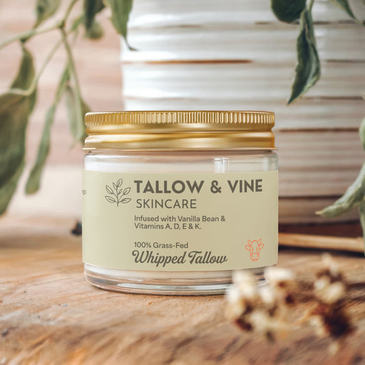 Grass-Fed Whipped Tallow Balm jar on wood table 